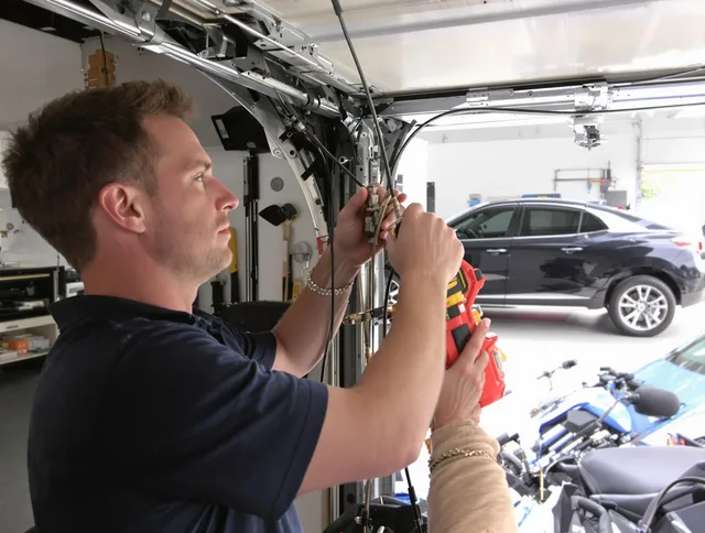 Waterford Garage Door Repair safety certified technician performing cable replacement in Waterford