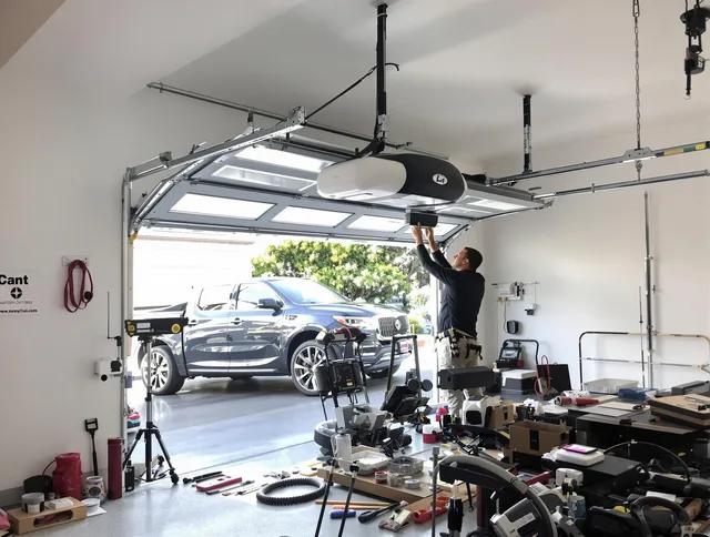 Waterford Garage Door Repair specialist installing smart garage door opener system in Waterford home