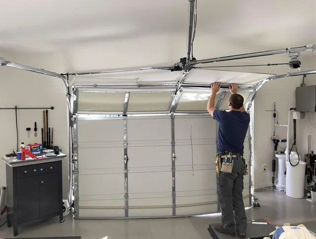 Waterford Garage Door Repair specialist performing precise section replacement on Waterford garage door